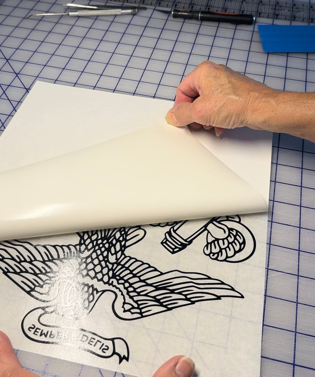Peeling the decal off the paper backing. CustomVinylDecals4U