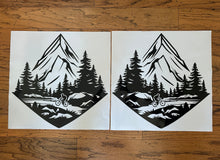 Load image into Gallery viewer, Die cut vinyl decals for cornhole boards depicting mountains lake and a mountain bike rider on the trail
